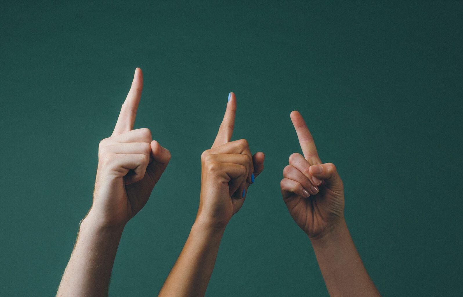 Strategies for forecasting sales revenue, three hands point their index fingers